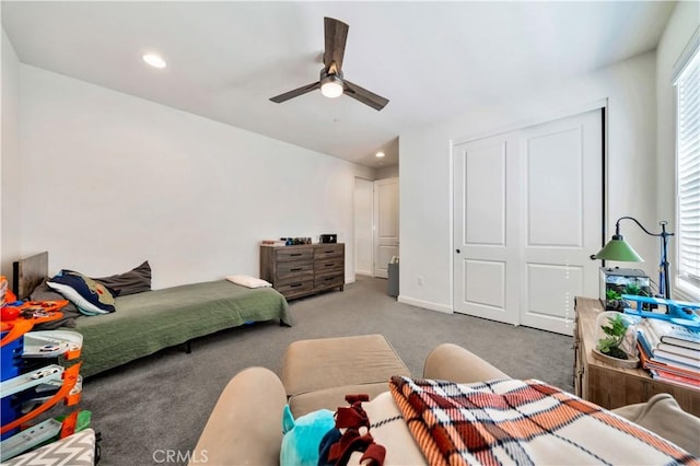 bedroom featuring carpet floors, a closet, and ceiling fan