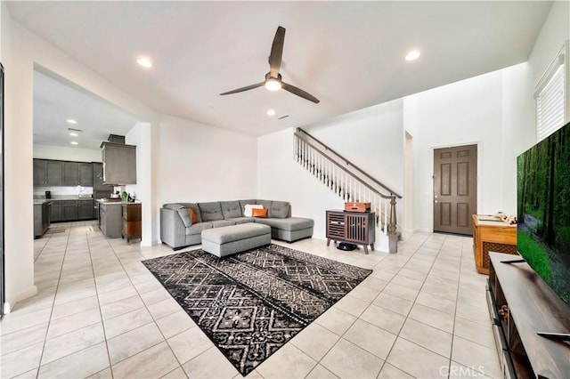 tiled living room featuring ceiling fan