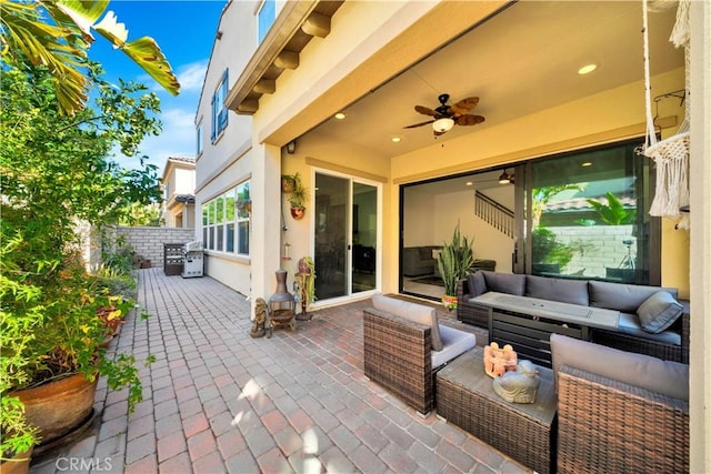 view of patio / terrace with an outdoor living space, ceiling fan, and a grill