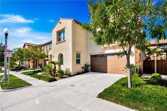 mediterranean / spanish home featuring a garage