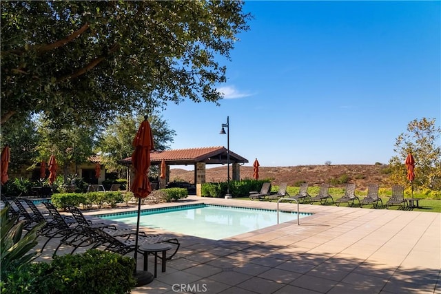 view of pool with a gazebo and a patio