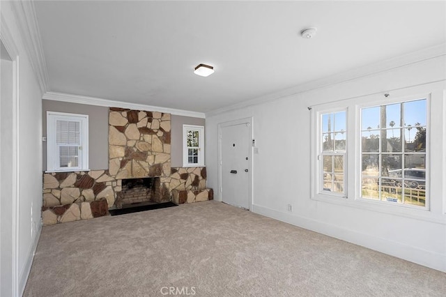 unfurnished living room with crown molding, carpet, and a fireplace