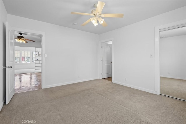 unfurnished bedroom with light colored carpet and ceiling fan