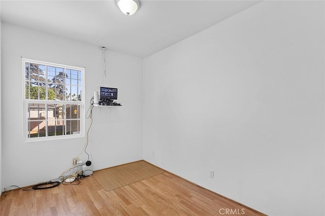 unfurnished room with hardwood / wood-style floors