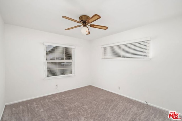 unfurnished room with ceiling fan and carpet floors