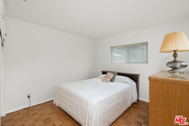 bedroom with parquet flooring