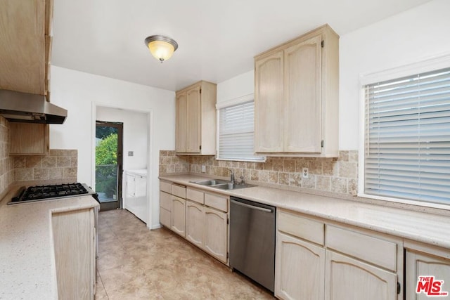 kitchen with ventilation hood, backsplash, sink, and appliances with stainless steel finishes