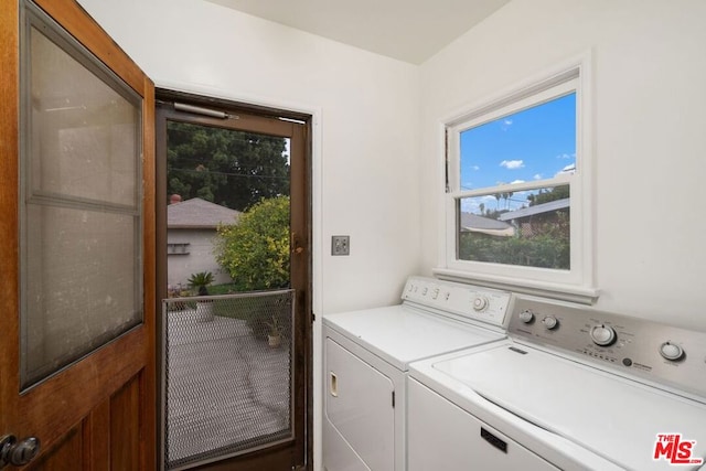 washroom featuring washer and dryer