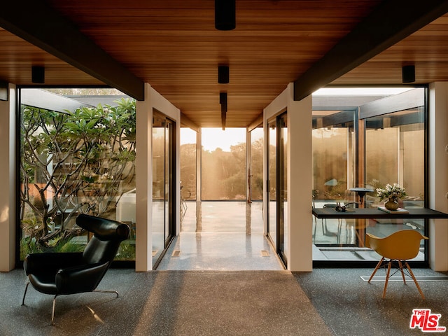 sunroom / solarium with beamed ceiling and wooden ceiling