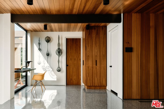 interior space featuring wooden ceiling and beamed ceiling