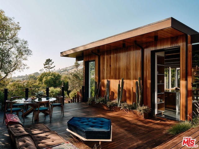 wooden terrace featuring a mountain view