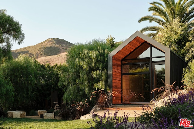 view of outdoor structure featuring a mountain view