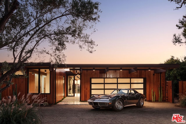 view of front of property with a garage