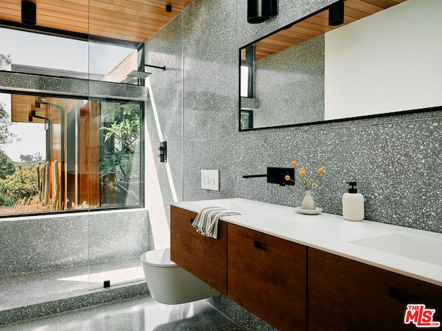 bathroom with vanity, toilet, a healthy amount of sunlight, and wooden ceiling