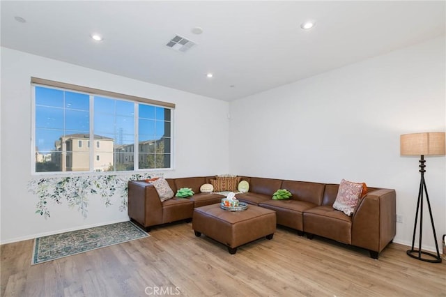 living room with light hardwood / wood-style floors