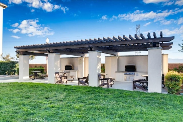 view of patio / terrace featuring an outdoor kitchen, area for grilling, and a pergola