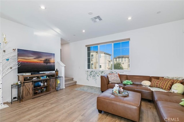 living room with light hardwood / wood-style floors