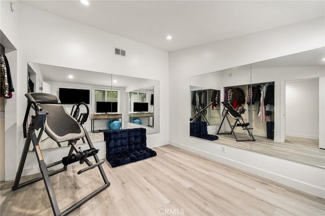 workout area featuring light wood-type flooring