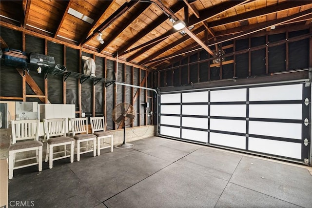 garage featuring wooden ceiling and a garage door opener