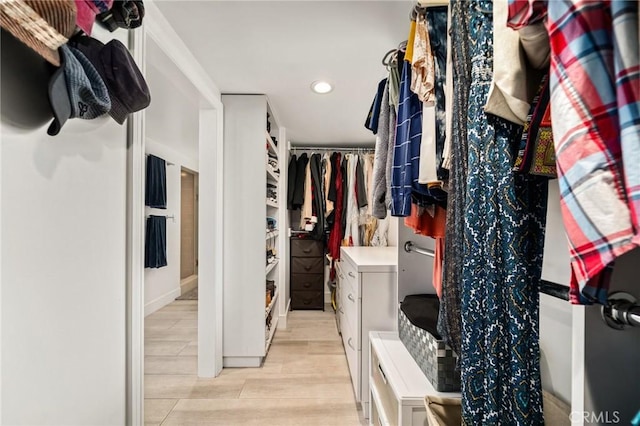 spacious closet featuring light wood-type flooring