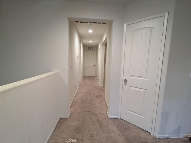 hallway with light carpet