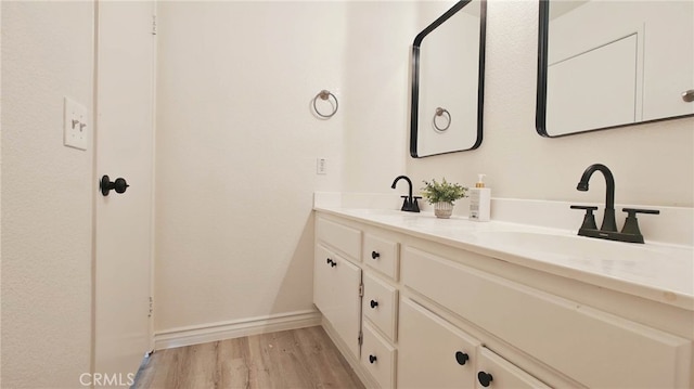 bathroom with vanity and hardwood / wood-style flooring