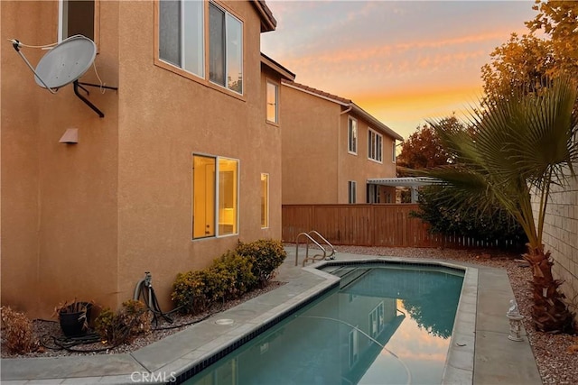 view of pool featuring a fenced backyard, a fenced in pool, and a patio