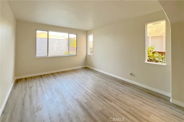 spare room with light wood-type flooring