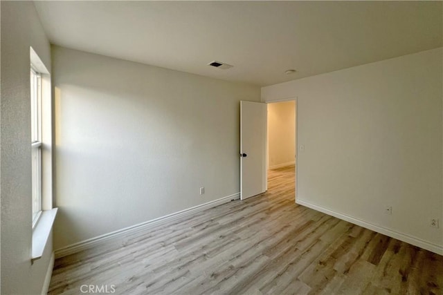 unfurnished bedroom with light wood-type flooring