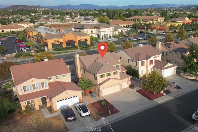 drone / aerial view with a residential view and a mountain view