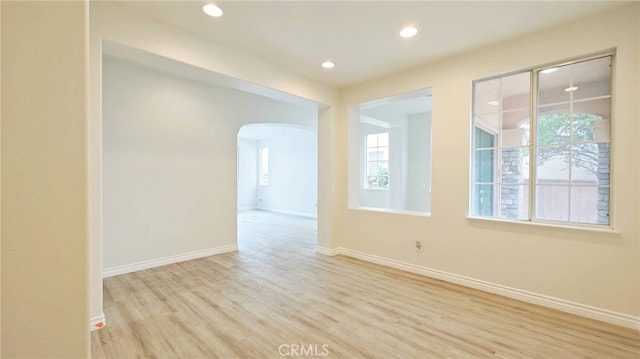 spare room featuring light wood-type flooring