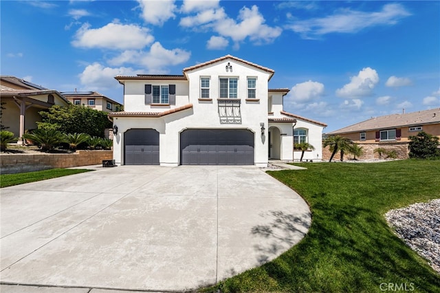 12750 Baltic Ct, Rancho Cucamonga, CA 91739 - mediterranean / spanish-style house featuring a tile roof, an attached garage, stucco siding, driveway, and a front yard