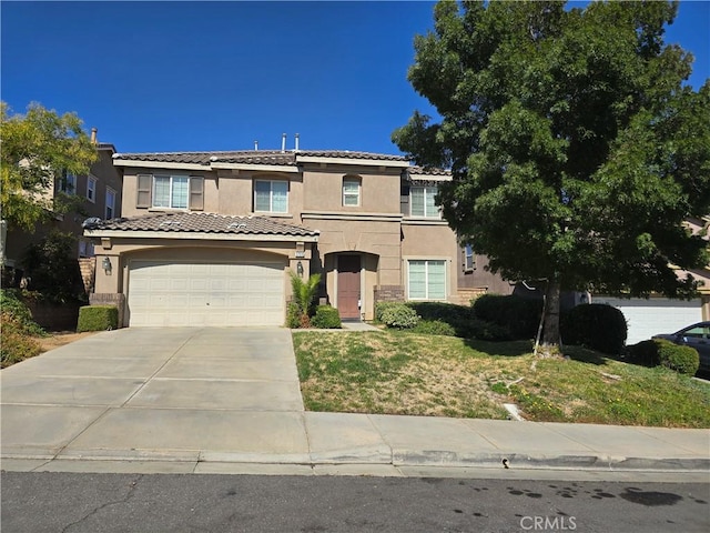 37515 Ruby Red Ln, Palmdale, CA 93551 - view of front of home with stucco siding, driveway, a front lawn, a tiled roof, and stone siding