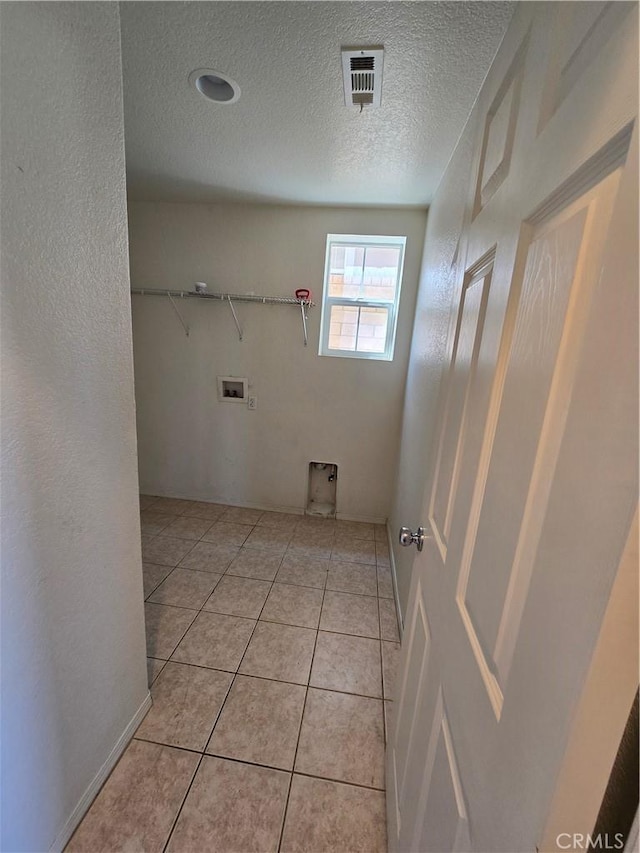 37515 Ruby Red Ln, Palmdale, CA 93551 - laundry room with a textured ceiling, hookup for a washing machine, and light tile patterned floors