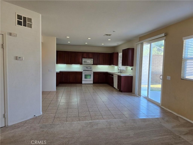 37515 Ruby Red Ln, Palmdale, CA 93551 - kitchen featuring white appliances, light tile patterned flooring, a sink, light countertops, and light colored carpet