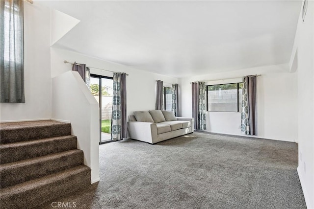 unfurnished living room featuring carpet flooring