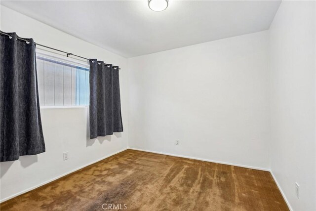 empty room featuring carpet floors