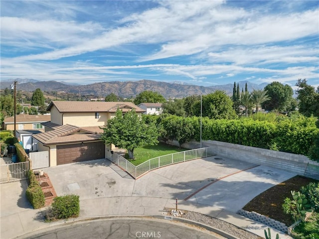 exterior space with a mountain view and a garage