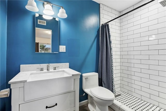 bathroom with vanity, toilet, and a shower with shower curtain