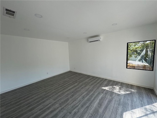 4812 E Seldner Ave, Los Angeles, CA 90032 - spare room featuring a wall unit AC and dark wood-style floors