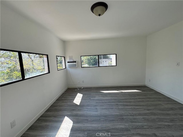 4812 E Seldner Ave, Los Angeles, CA 90032 - spare room with dark wood finished floors and an AC wall unit