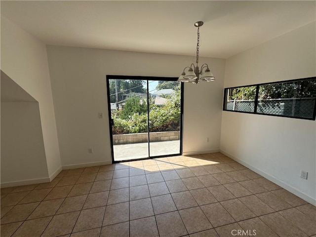 4812 E Seldner Ave, Los Angeles, CA 90032 - tiled spare room featuring a chandelier and baseboards