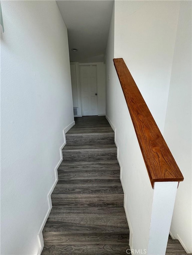 stairs with hardwood / wood-style flooring