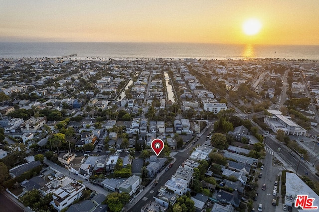 aerial view at dusk with a water view