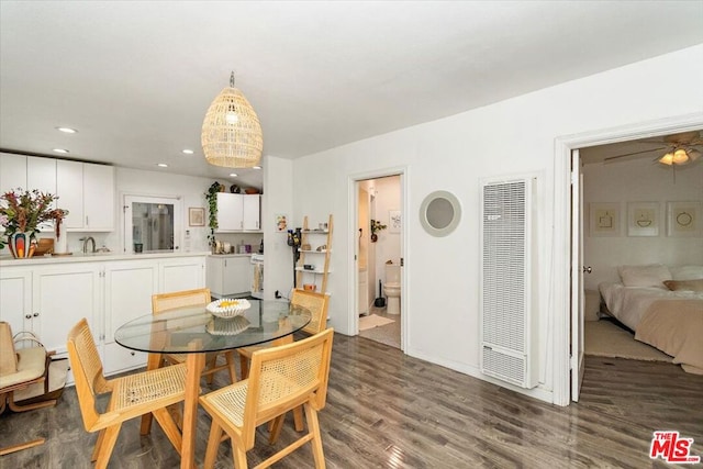 dining space with dark hardwood / wood-style floors and ceiling fan