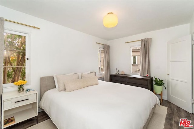 bedroom featuring dark hardwood / wood-style flooring