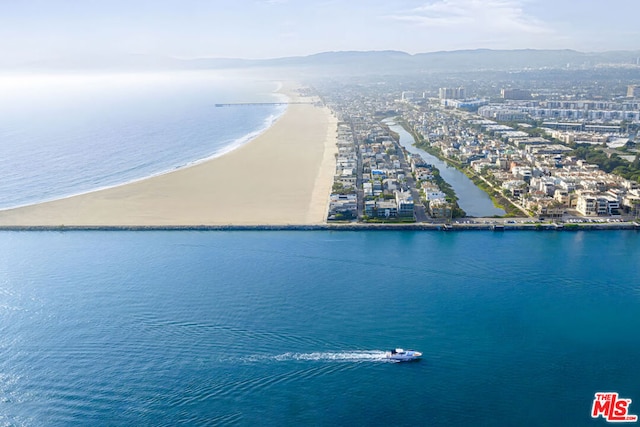 bird's eye view with a water and mountain view and a beach view