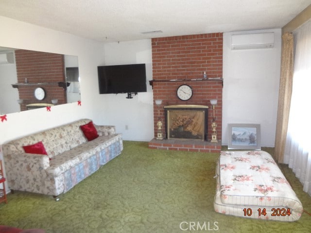 living room with a wall mounted air conditioner, carpet flooring, and a fireplace