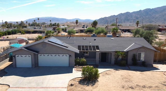 exterior space featuring a mountain view and a garage