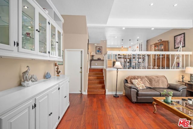 living room with dark hardwood / wood-style flooring